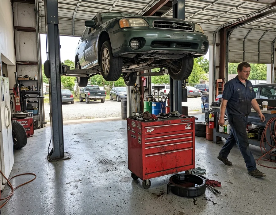 Auto service bay with chemical-resistant grey epoxy floor