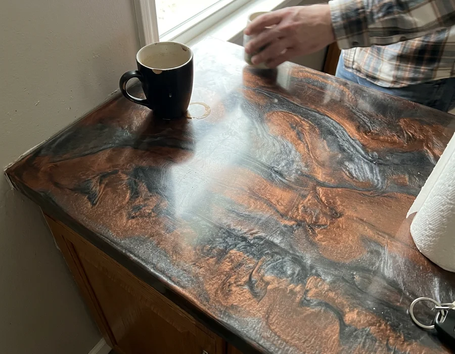 Close-up of metallic epoxy showing mica pigment depth and gloss
