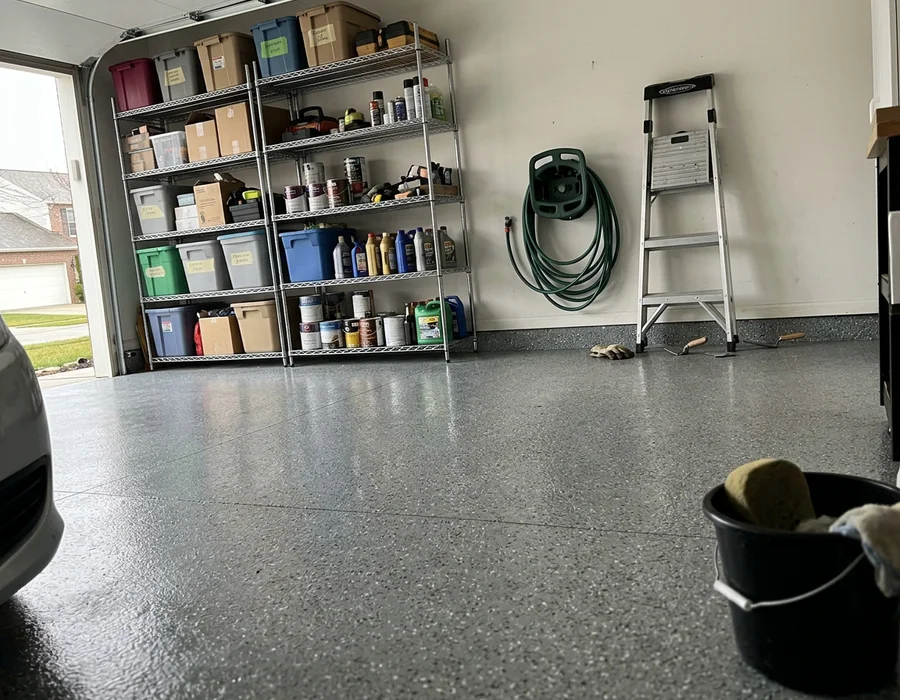 Full-broadcast grey flake garage floor with glossy topcoat